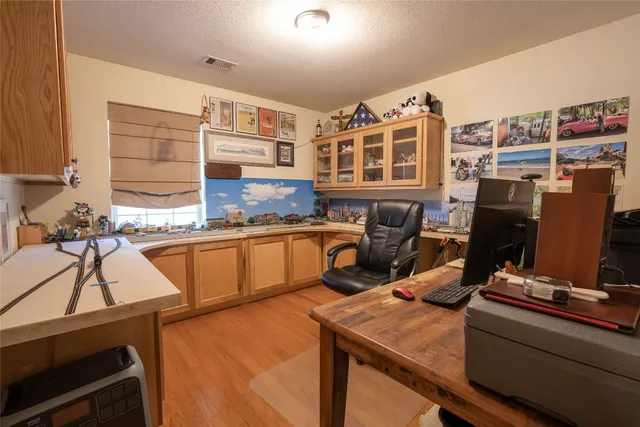 a kitchen with a table chairs and a stove top oven