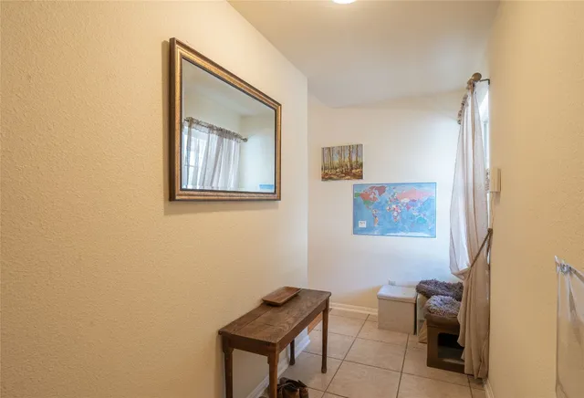 a view of room with window and furniture