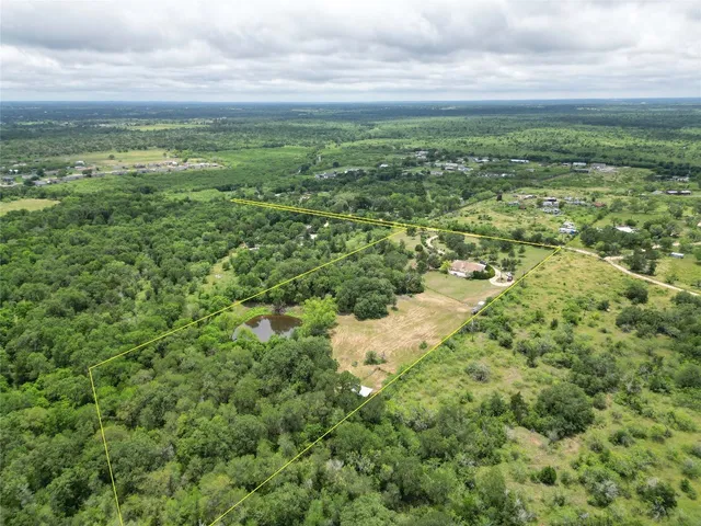 a view of a field with an ocean