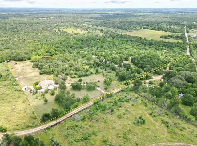a view of a field with an ocean view