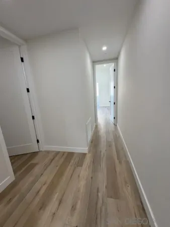a spacious bathroom with a double vanity sink and mirror
