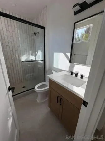 a view of a room with wooden floor and chair