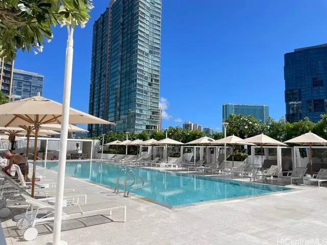 a view of house with outdoor space and swimming pool