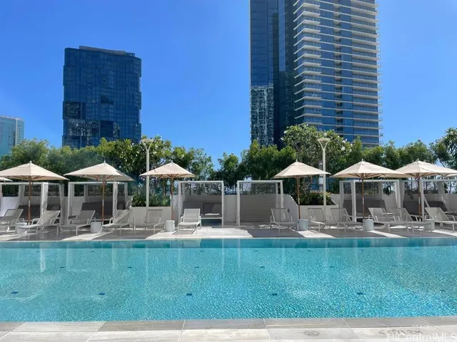 a front view of a house with yard and green space