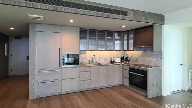 a kitchen with stainless steel appliances granite countertop a stove and a refrigerator