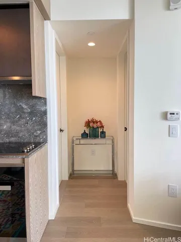 a view of a kitchen cabinets and a wooden floor