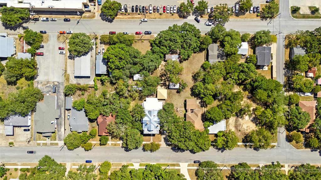 514 South Main Street Lockhart, TX 78644 - Photo 14 of 14 an aerial view of a house with a yard and lake view