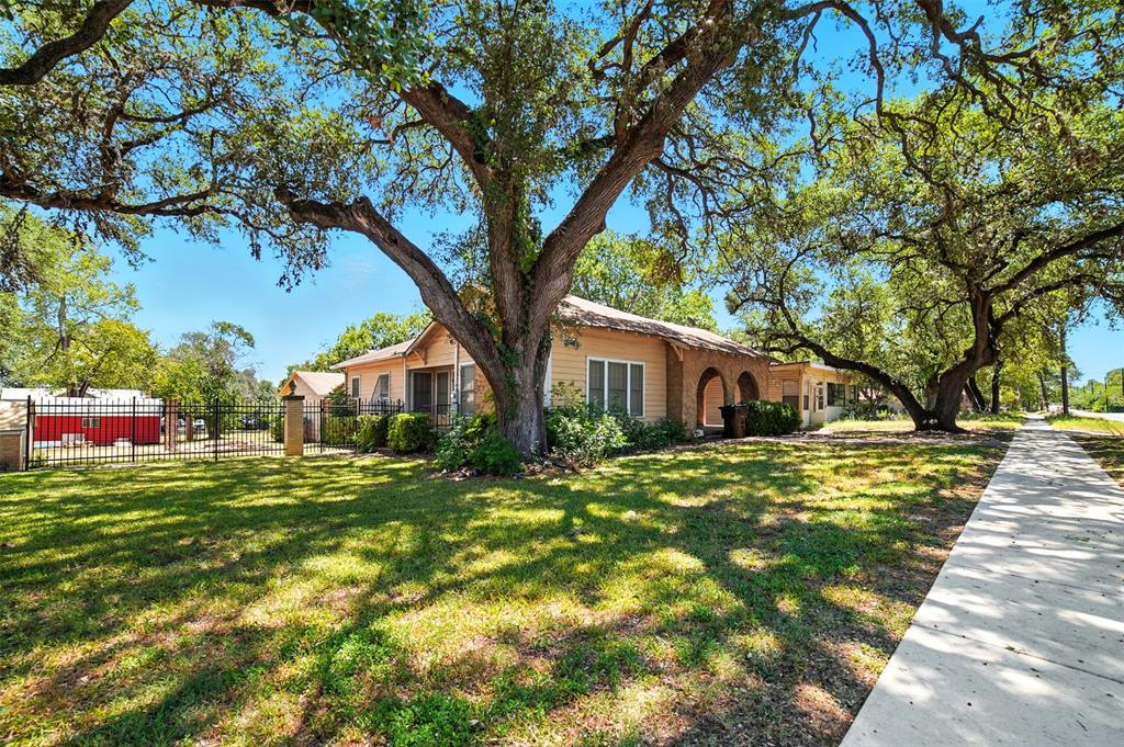514 South Main Street Lockhart, TX 78644 - Photo 3 of 14 a front view of a house with a yard