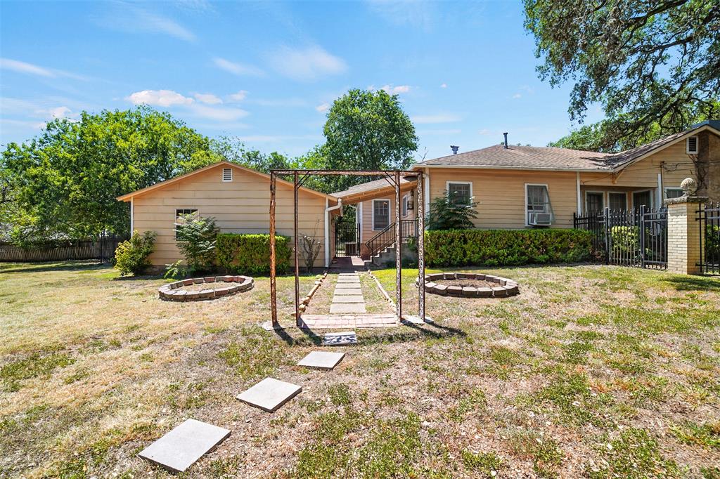514 South Main Street Lockhart, TX 78644 - Photo 4 of 14 a view of a house with backyard and sitting area