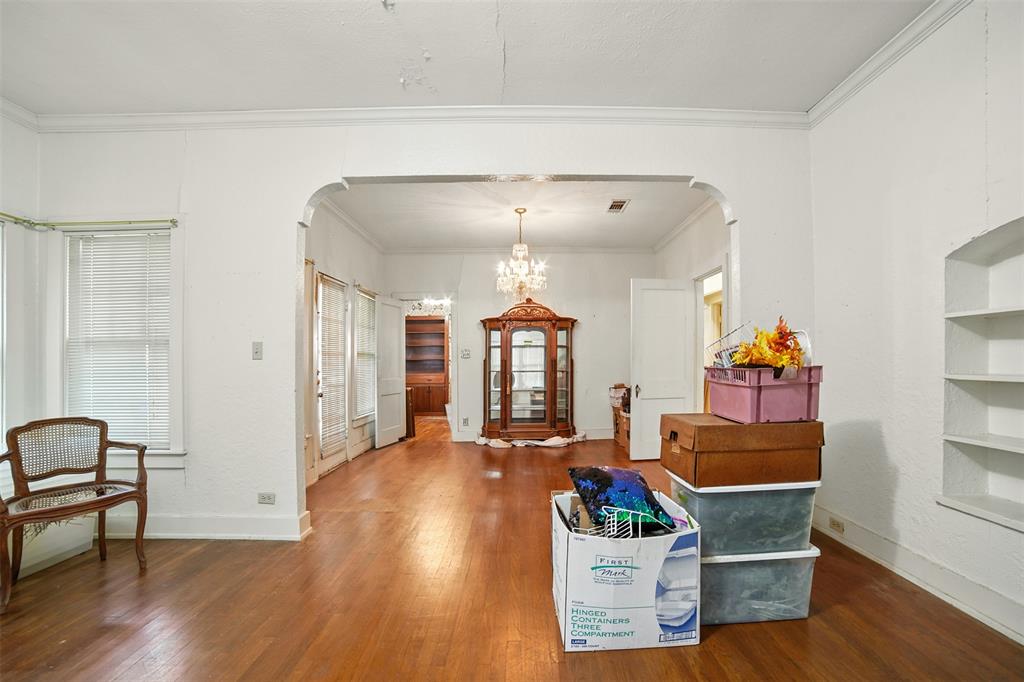 514 South Main Street Lockhart, TX 78644 - Photo 9 of 14 a living room with furniture and wooden floor