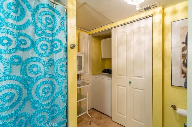 a bedroom with a bed and dresser