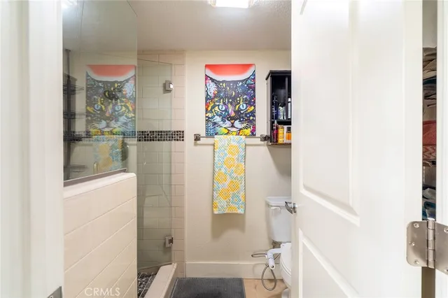 a bathroom with a granite countertop sink and a large mirror