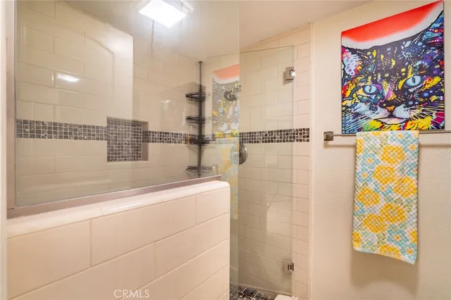 a backyard of a house with barbeque oven table and chairs