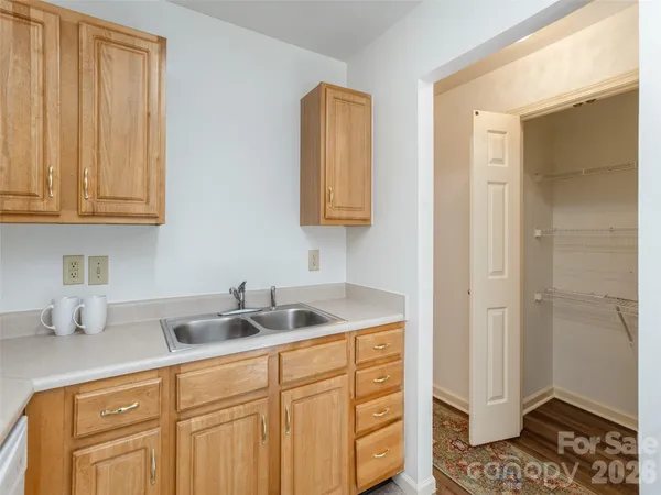 a kitchen with a sink and cabinets