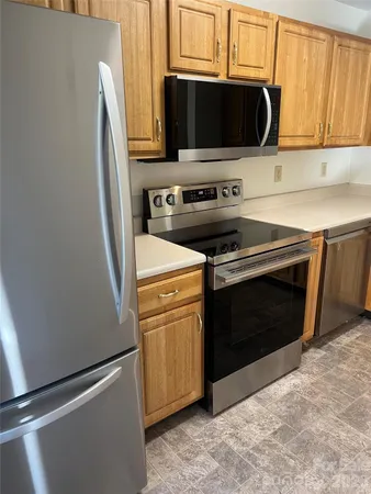 a kitchen with a stove and a microwave