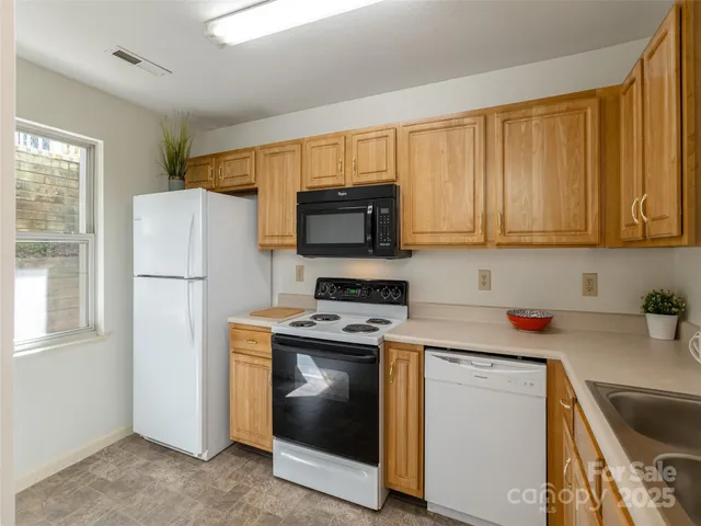 a kitchen with a stove microwave and refrigerator