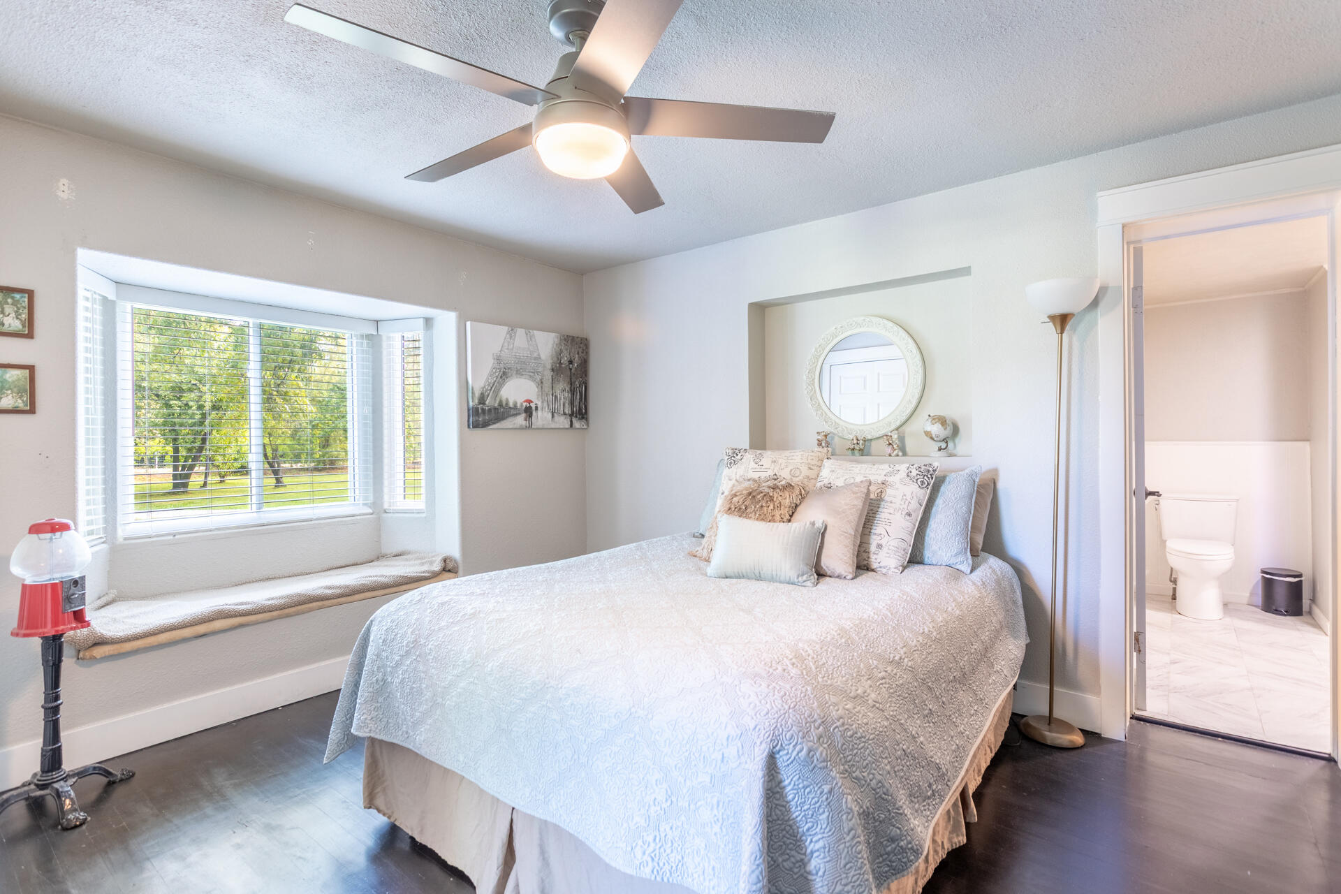 4832 Balls Ferry Road Anderson, CA 96007 - Photo 16 of 51 a bedroom with a large bed and a chandelier fan