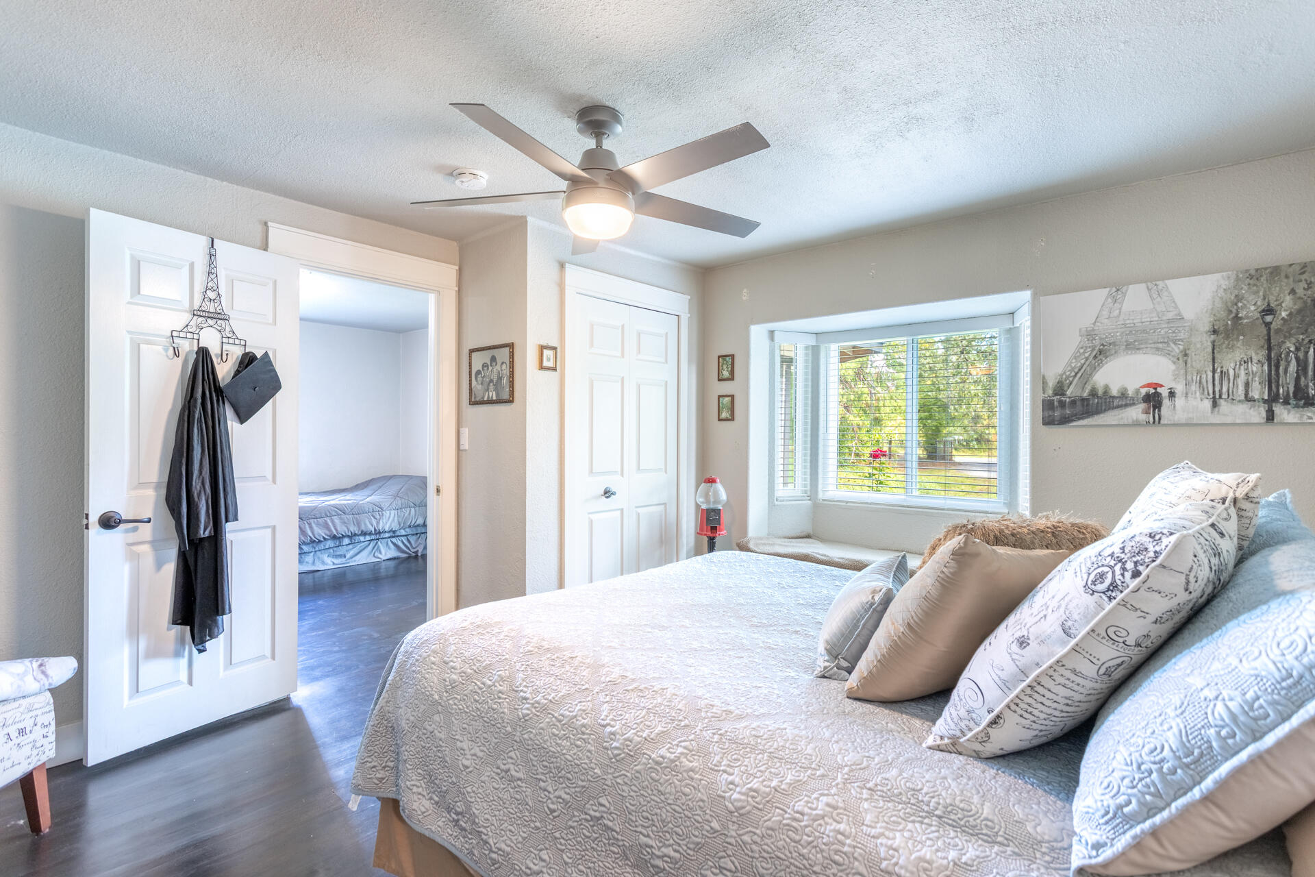 4832 Balls Ferry Road Anderson, CA 96007 - Photo 17 of 51 a bedroom with a bed and a large mirror with wooden floor