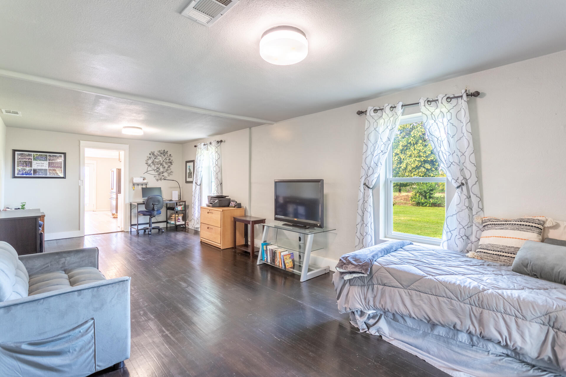 4832 Balls Ferry Road Anderson, CA 96007 - Photo 18 of 51 a bedroom with a bed and a couch