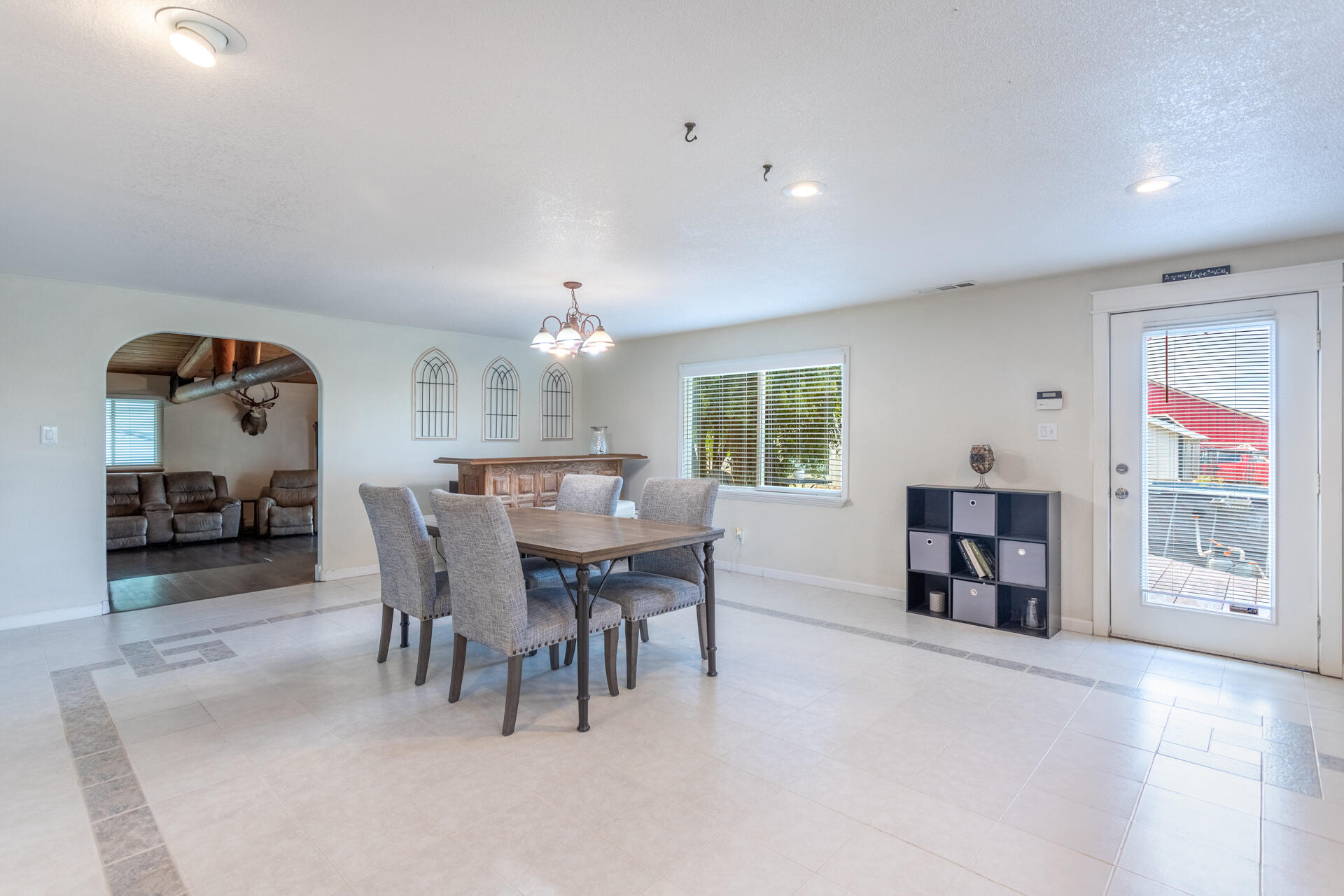 4832 Balls Ferry Road Anderson, CA 96007 - Photo 23 of 51 a view of a dining room with furniture and a chandelier