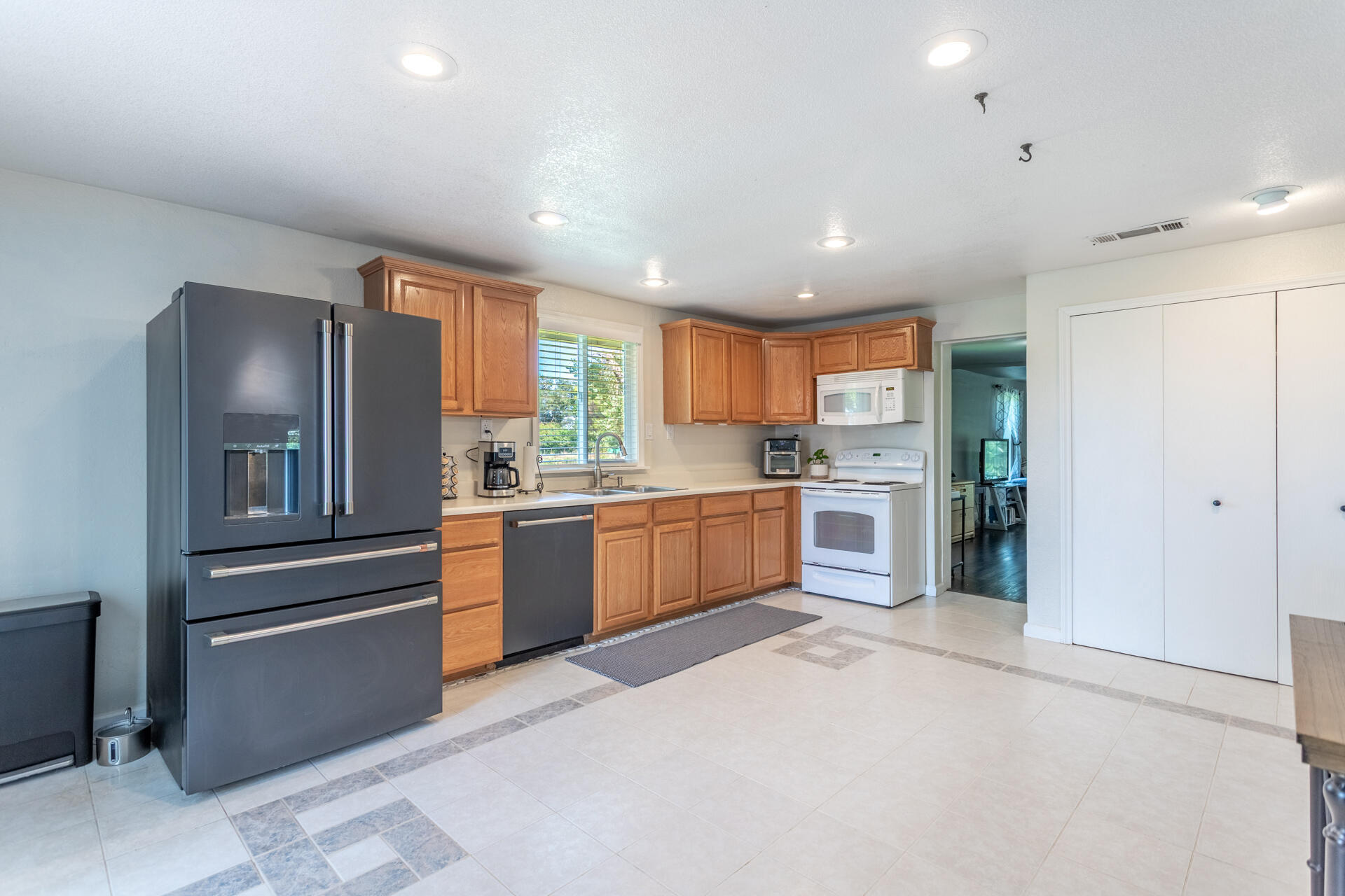 4832 Balls Ferry Road Anderson, CA 96007 - Photo 24 of 51 a kitchen with stainless steel appliances granite countertop a refrigerator and a stove top oven
