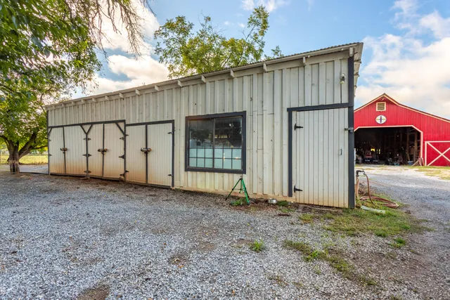a view of a barn with a yard