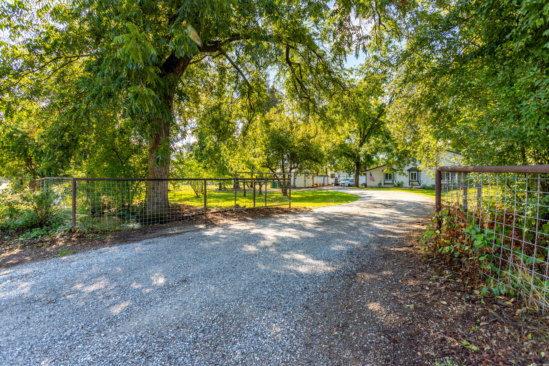 4832 Balls Ferry Road Anderson, CA 96007 - Photo 40 of 51 a view of a street with a yard and trees