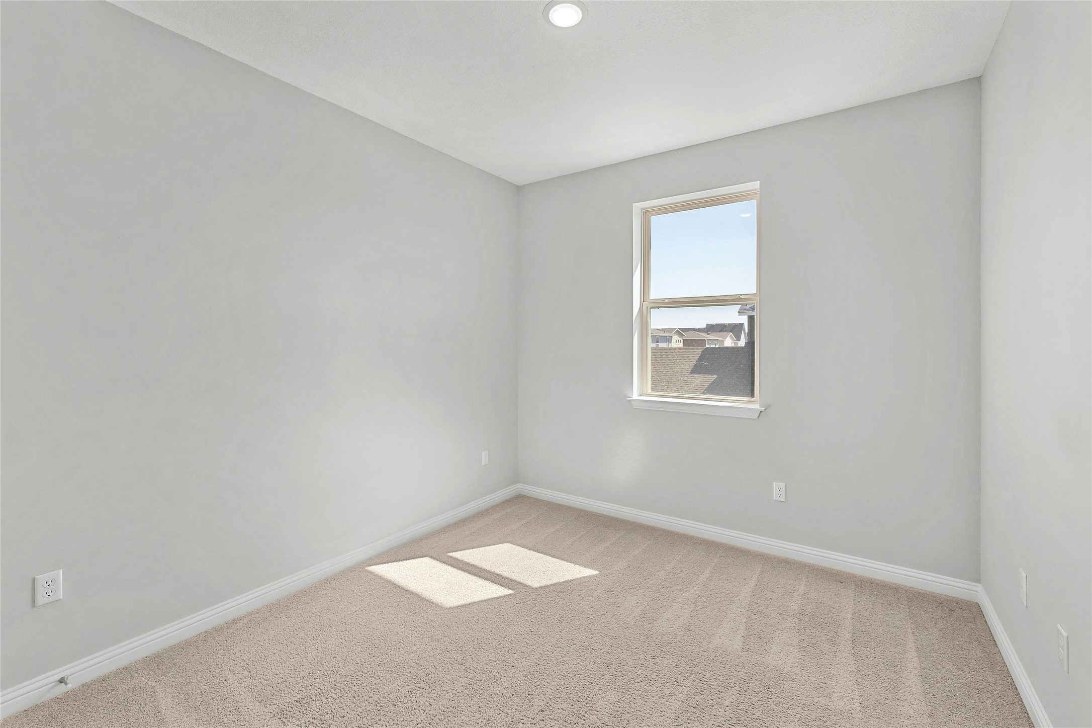 8101 Frida Bend Austin, TX 78744 - Photo 24 of 30 Unfurnished room featuring baseboards and light carpet