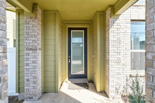a front view of a house with a glass door