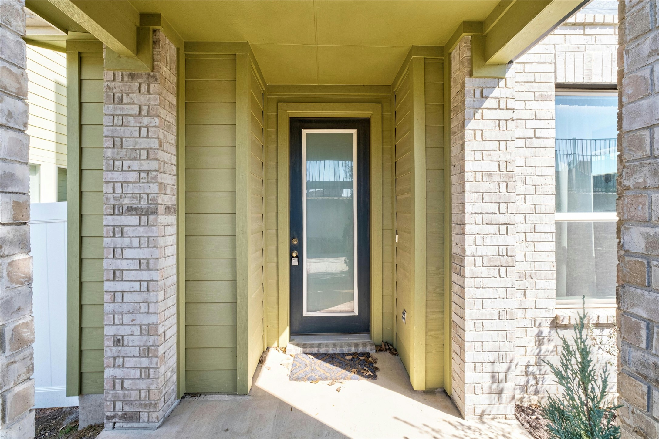 8101 Frida Bend Austin, TX 78744 - Photo 3 of 30 View of exterior entry featuring brick siding