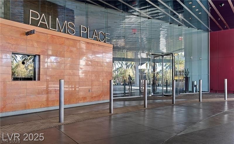 4381 West Flamingo Road, Unit 1809 Las Vegas, NV 89103 - Photo 9 of 11 Building lobby featuring a high ceiling