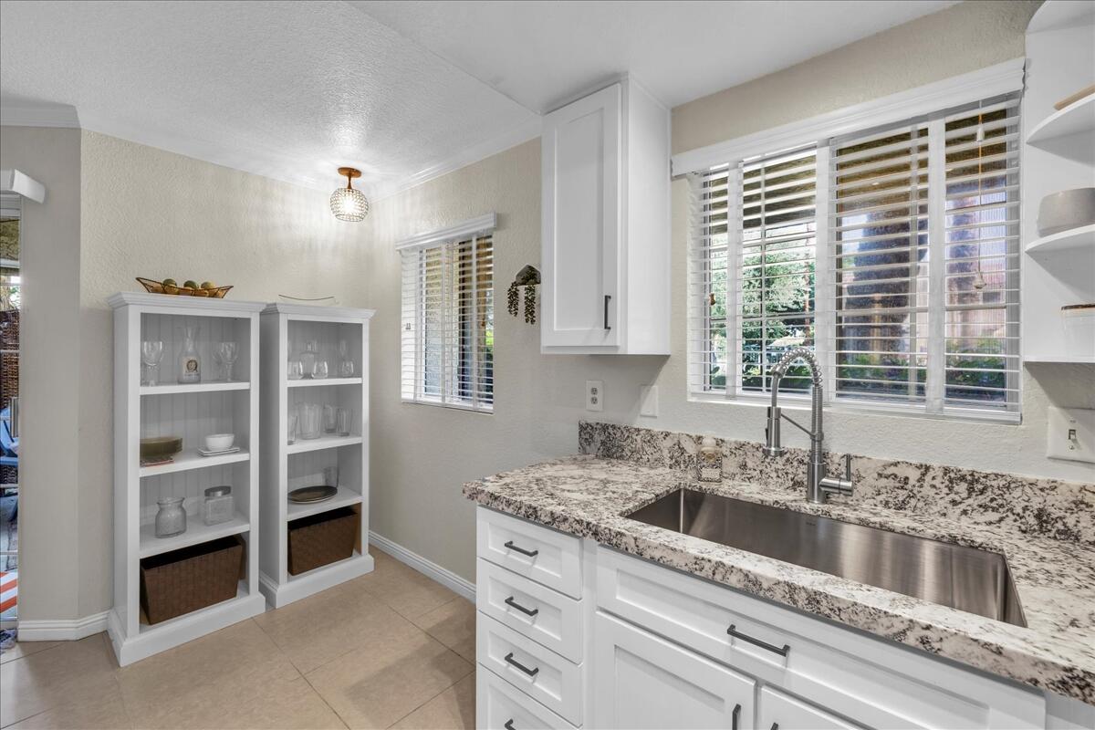 2700 Lawrence Crossley Road, Unit 83 Palm Springs, CA 92264 - Photo 15 of 52 a kitchen with a sink and cabinets