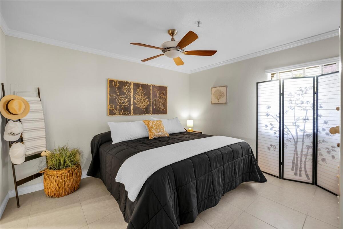 2700 Lawrence Crossley Road, Unit 83 Palm Springs, CA 92264 - Photo 18 of 52 a bedroom with a bed and ceiling fan