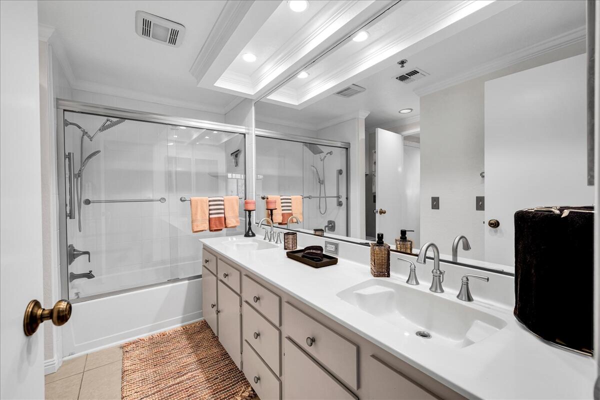 2700 Lawrence Crossley Road, Unit 83 Palm Springs, CA 92264 - Photo 22 of 52 a bathroom with a double vanity sink a mirror and shower