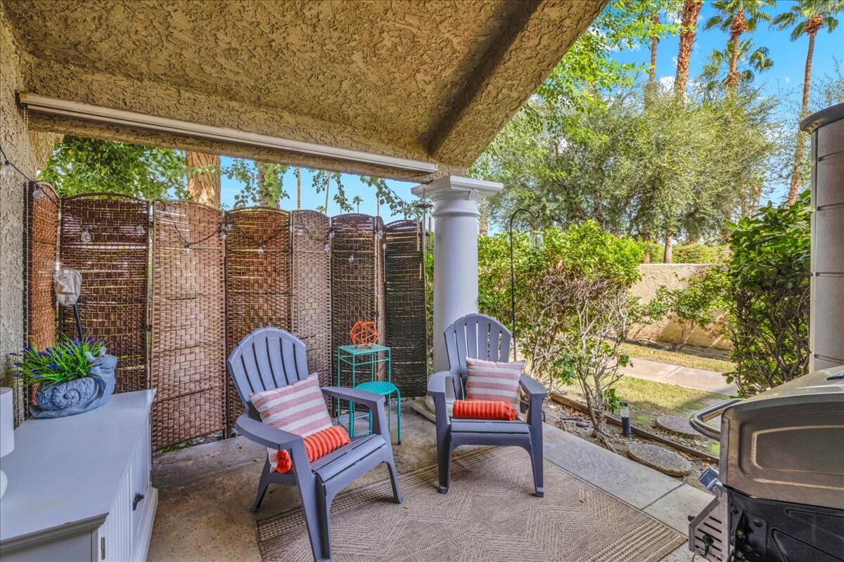 2700 Lawrence Crossley Road, Unit 83 Palm Springs, CA 92264 - Photo 24 of 52 a outdoor living space with furniture and garden view