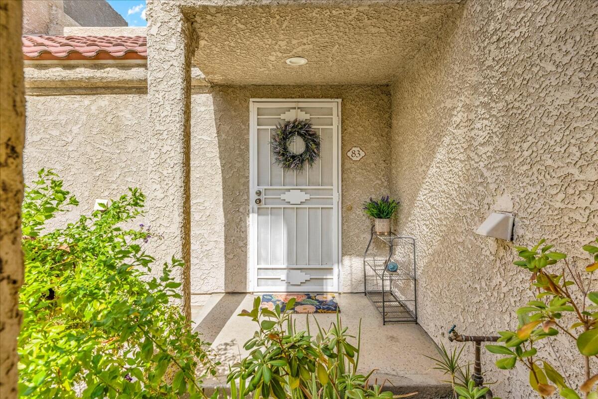 2700 Lawrence Crossley Road, Unit 83 Palm Springs, CA 92264 - Photo 28 of 52 a front view of a house with a yard