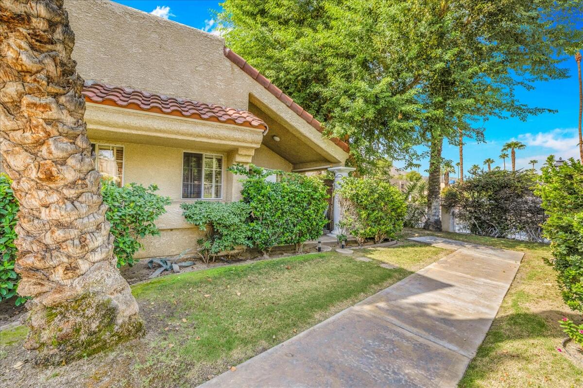 2700 Lawrence Crossley Road, Unit 83 Palm Springs, CA 92264 - Photo 31 of 52 a view of a house with a yard