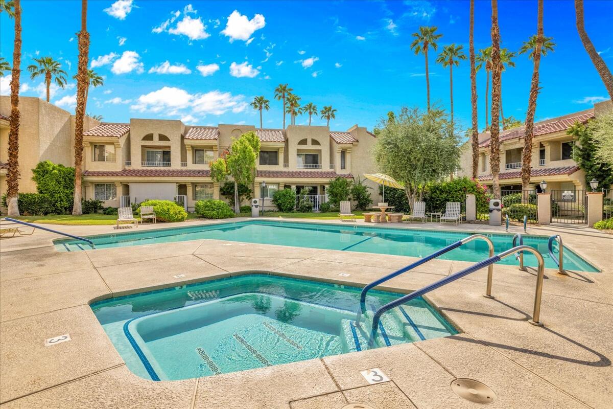 2700 Lawrence Crossley Road, Unit 83 Palm Springs, CA 92264 - Photo 33 of 52 a view of swimming pool with outdoor seating and yard