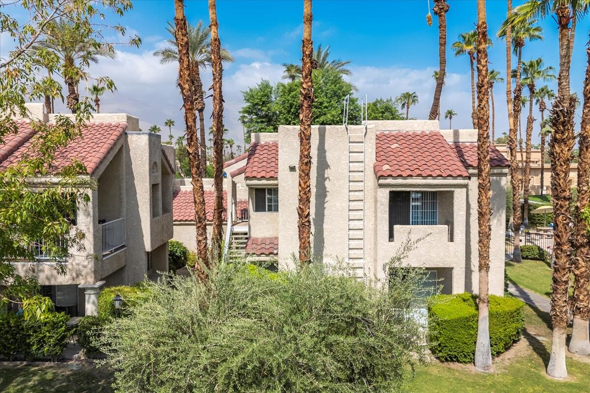 2700 Lawrence Crossley Road, Unit 83 Palm Springs, CA 92264 - Photo 37 of 52 a aerial view of a house with a yard and potted plants
