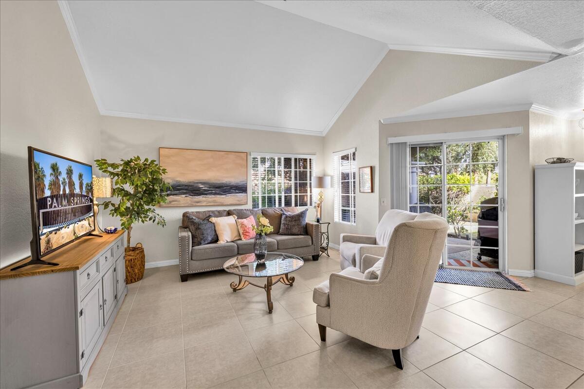 2700 Lawrence Crossley Road, Unit 83 Palm Springs, CA 92264 - Photo 4 of 52 a living room with furniture and a flat screen tv