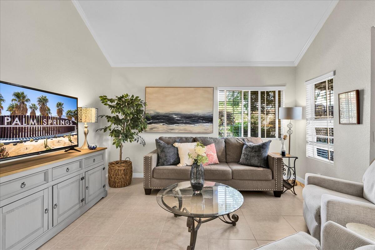 2700 Lawrence Crossley Road, Unit 83 Palm Springs, CA 92264 - Photo 6 of 52 a living room with furniture and a large window