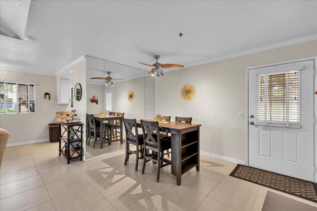 2700 Lawrence Crossley Road, Unit 83 Palm Springs, CA 92264 - Photo 8 of 52 a view of a dining area with furniture and a window