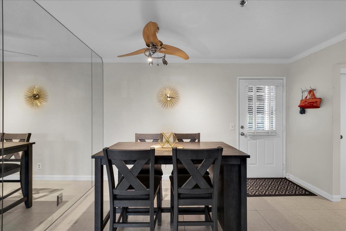 2700 Lawrence Crossley Road, Unit 83 Palm Springs, CA 92264 - Photo 9 of 52 a view of a dining room with furniture and a chandelier
