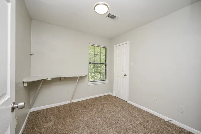 an empty room with windows