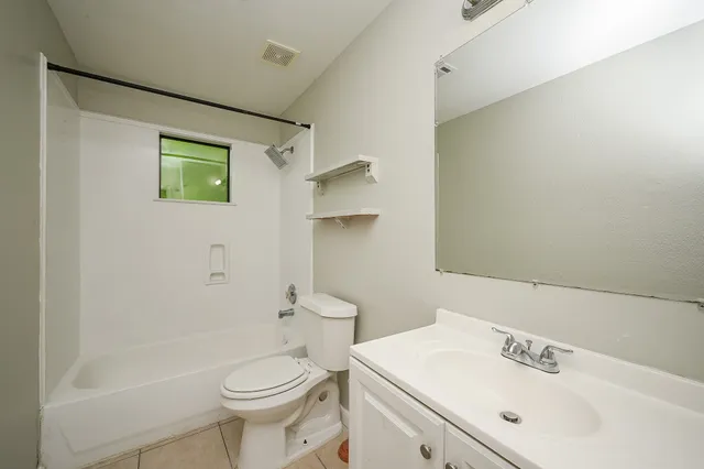 a bathroom with a sink a toilet and a bathtub