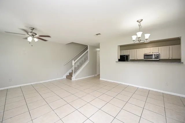 a view of a livingroom with a chandelier furniture and chandelier