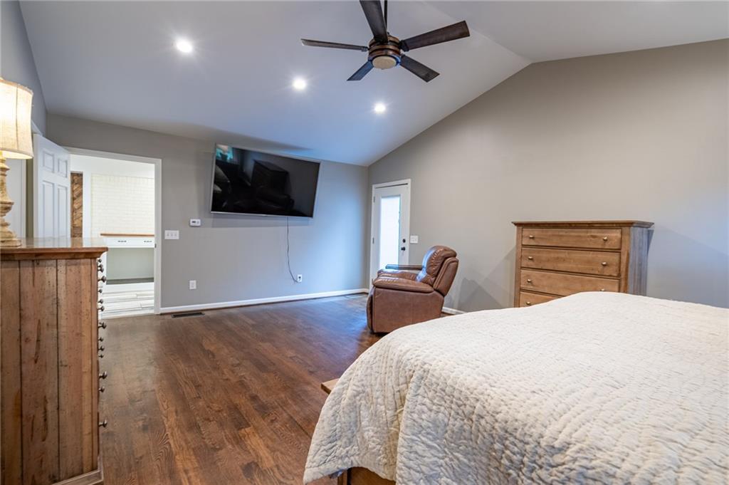 4067 Mason Creek Road Winston, GA 30187 - Photo 20 of 48 a bedroom with a bed and a flat screen tv
