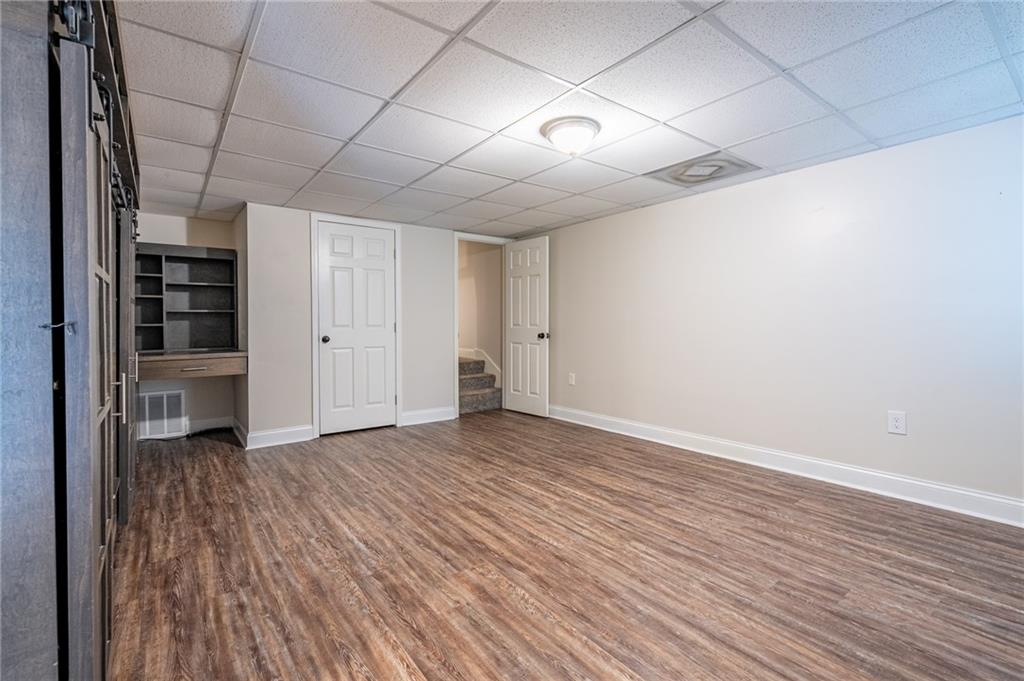 4067 Mason Creek Road Winston, GA 30187 - Photo 25 of 48 a view of empty room with wooden floor