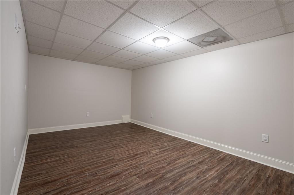 4067 Mason Creek Road Winston, GA 30187 - Photo 29 of 48 a view of an empty room with wooden floor