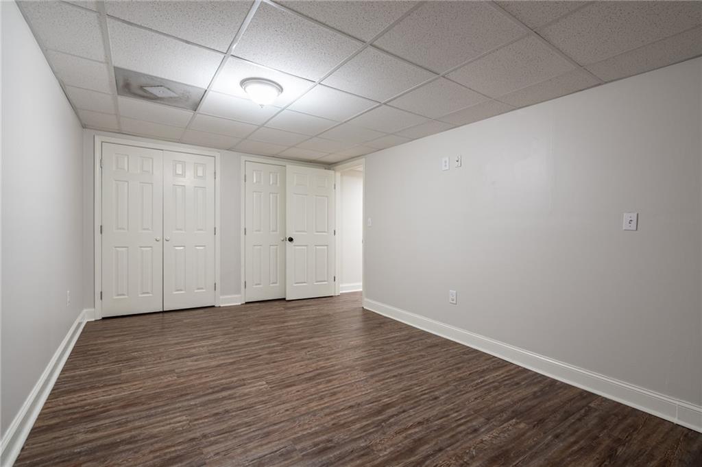 4067 Mason Creek Road Winston, GA 30187 - Photo 30 of 48 a view of an empty room with wooden floor
